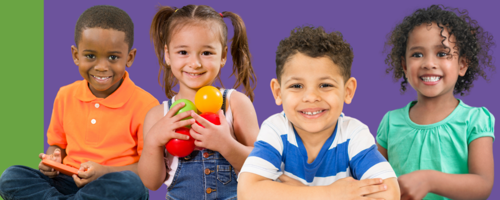 Four young children smiling